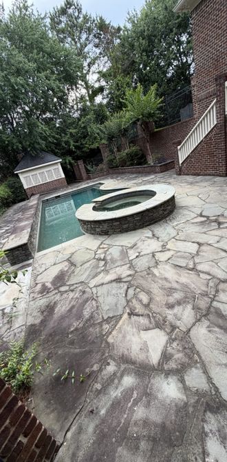 Stone pool deck before cleaning