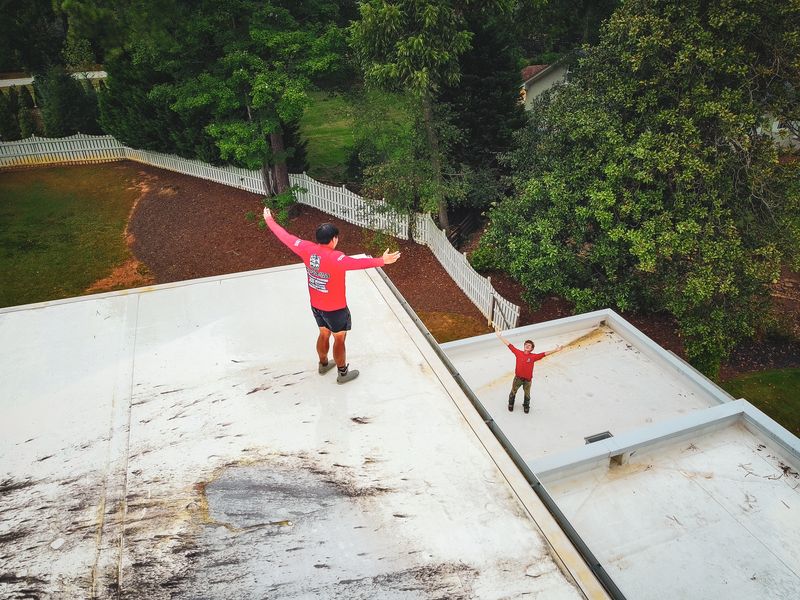 Crew on a roof cleaning job
