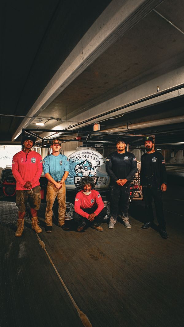 POW team with their equipment in a commercial parking garage