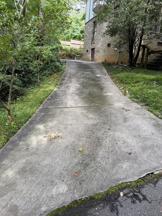 Sloped driveway before cleaning